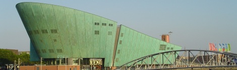 The sci-tech museum NEMO looks like a ship rising from the water. Designed by Rem Koolhaas. Courtesy of wikipedia.