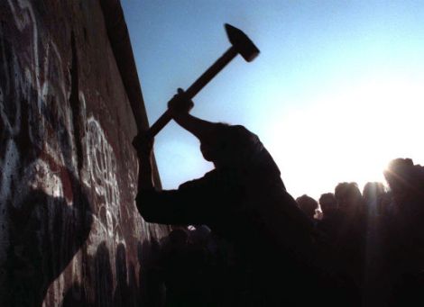 Taking down the Berlin Wall. Courtesy of Huffington Post